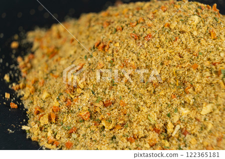 Natural seasoning with flavor enhancer, dried vegetables and salt 122365181