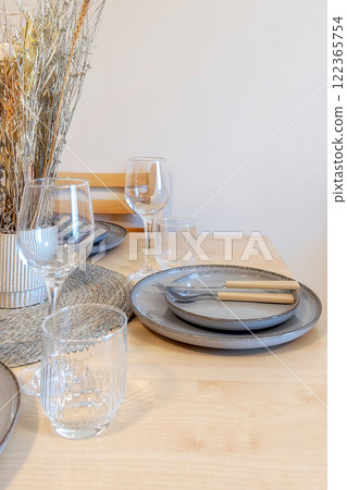 table setting with dry flowers in room 122365754