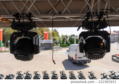 Concert lighting equipment awaits installation on stage Concert lighting equipment awaits installation on stage 122365831