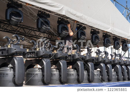 Installation of lighting equipment on a mobile concert stage. 122365881