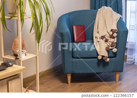 Close up of the cozy corner in the apartment with comfortable arm chair. 122366157
