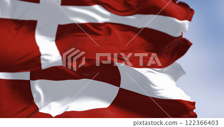 Flags of Greenland and Denmark waving in the wind 122366403