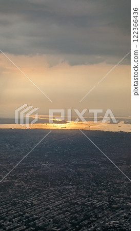 View of New York from an airplane. Vertical. Sunset 122366436