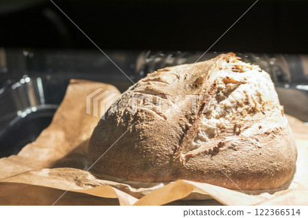 Shot of the freshly baked loaf of home made rye bread in the oven 122366514