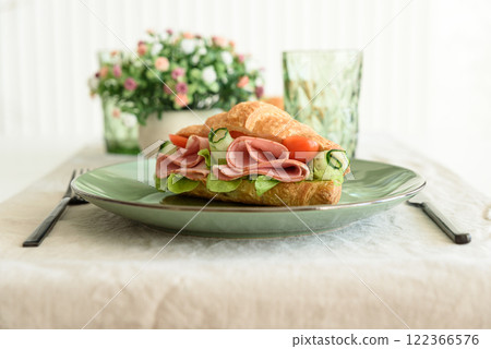 Ham and Cheese Croissant Sandwich. Healthy breakfast. Front view Ham and Cheese Croissant Sandwich. Healthy breakfast. Front view 122366576