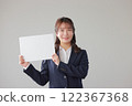 Business woman holding a message board_1 122367368