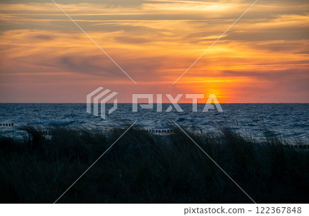 Sunset at Zingst Beach, Darss, Germany Sunset at Zingst Beach, Darss, Germany 122367848