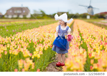 Dutch children in tulip field 122368059