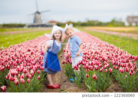 Dutch children in tulip field 122368060
