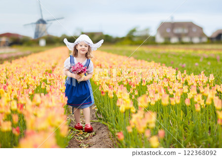 Dutch children in tulip field 122368092