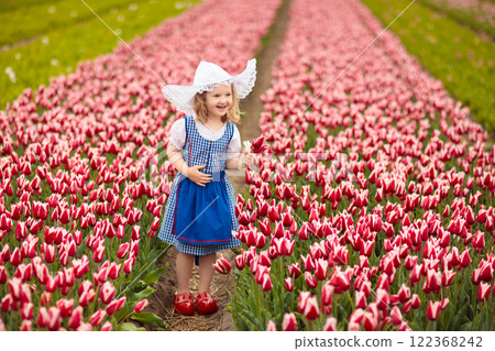 Dutch children in tulip field 122368242