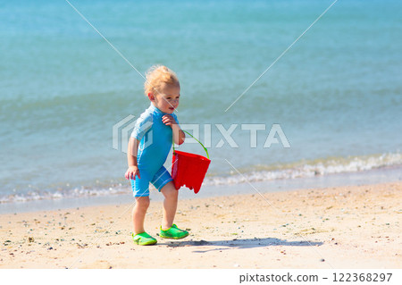 Kids playing on beach. Children play at sea. 122368297