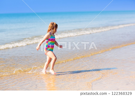 Kids playing on beach. Children play at sea. Kids playing on beach. Children play at sea. 122368329