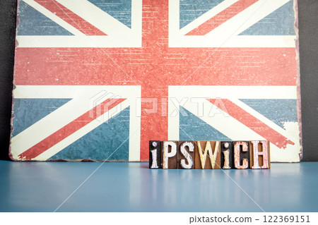 IPSWICH. Urban Area in Great Britain. Flag and alphabet letters on wooden texture background IPSWICH. Urban Area in Great Britain. Flag and alphabet letters on wooden texture background 122369151