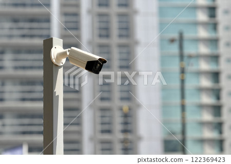 Camera security system have waterproof cover to protect camera installed on an iron pole with home security system concept in blue sky background 122369423