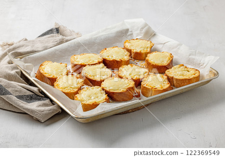 freshly baked cheese toasts freshly baked cheese toasts 122369549