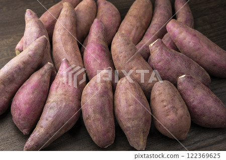Sweet potatoes on a wooden table 122369625
