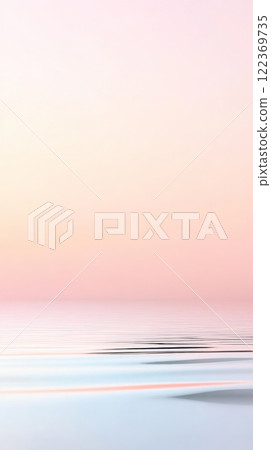 Ripples gently disturbing the surface of calm water reflecting a serene sky painted with soft hues of pink, yellow, and pale blue, creating a dreamy and tranquil atmosphere 122369735