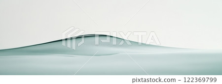 Smooth, rippling water surface creating gentle waves, with an air bubble trapped beneath, forming a serene and minimalist aquatic scene filled with calming hues of turquoise and blue 122369799