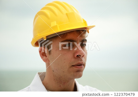 Engineer Angry About Bad Work Done By Workers Nervously Scolding Them On Beach Engineer Angry About Bad Work Done By Workers Nervously Scolding Them On Beach 122370479