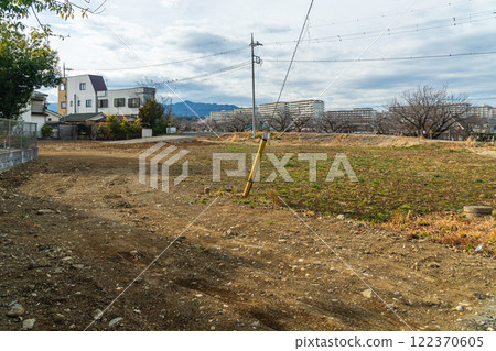 Landscape with a large vacant lot Landscape with a large vacant lot 122370605