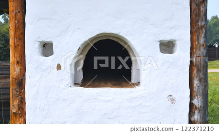 Traditional Russian oven, outdoors under a canopy. The picture was taken in Russia, in the city of Orenburg Traditional Russian oven, outdoors under a canopy. The picture was taken in Russia, in the city of Orenburg 122371210