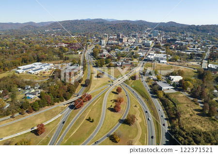 Aerial view of american freeway intersection in fall season in Asheville, North Carolina with fast moving cars and trucks. USA transportation infrastructure concept 122371521