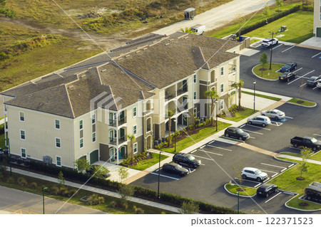 Aerial view of american apartment buildings in Florida residential area. New family condos as example of housing development in US suburbs 122371523