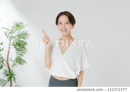 A woman posing in yoga wear A woman posing in yoga wear 122372377