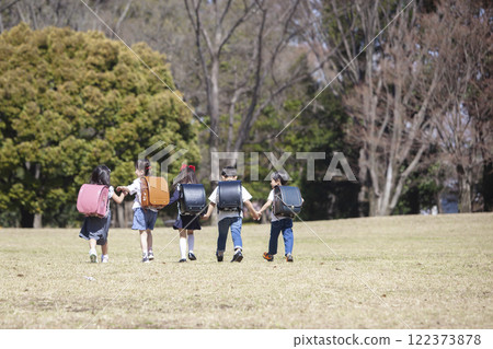 Five first-year students commuting to school 122373878