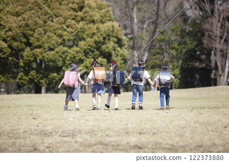 Five first-year students commuting to school 122373880