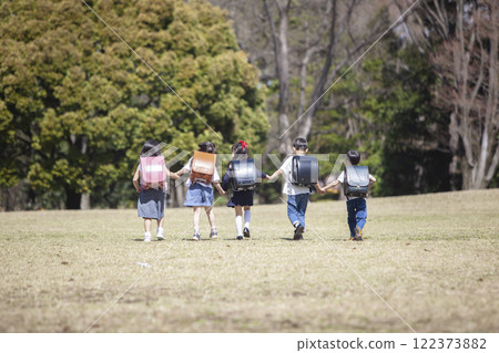 Five first-year students commuting to school 122373882