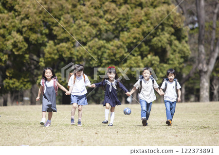 Five first-year students commuting to school 122373891