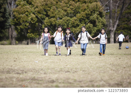 Five first-year students commuting to school 122373893
