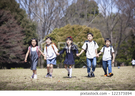 Five first-year students commuting to school 122373894