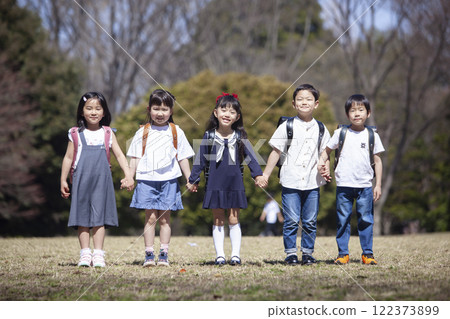 Five first-year students commuting to school 122373899