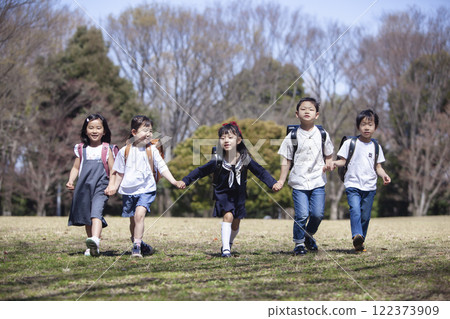 Five first-year students commuting to school 122373909