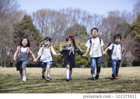Five first-year students commuting to school 122373911