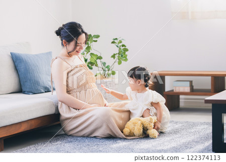 Parents and children relaxing in the living room Parents and children relaxing in the living room 122374113
