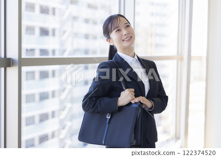 Job hunting: Portrait of a woman in a suit 122374520
