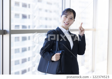 Job hunting: Portrait of a woman in a suit Job hunting: Portrait of a woman in a suit 122374523