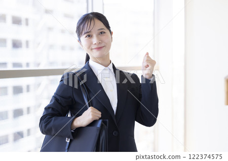 Job hunting: Portrait of a woman in a suit 122374575