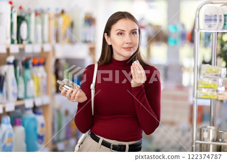 Young woman choosing perfume 122374787