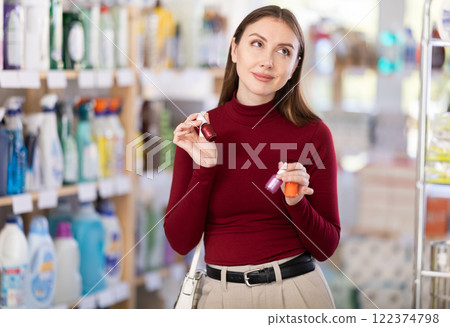 Woman choosing nail polishes 122374798