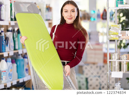 Woman choosing a folding board 122374834