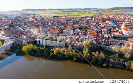 Drone view of Spanish town of Tordesillas on Duero river Drone view of Spanish town of Tordesillas on Duero river 122374931