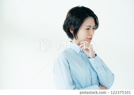 A woman who is concerned about her jawline A woman who is concerned about her jawline 122375101