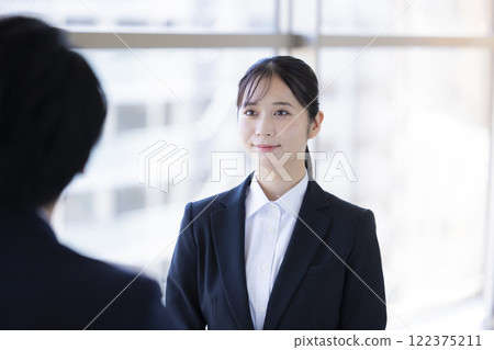Job hunting: Woman undergoing an interview 122375211