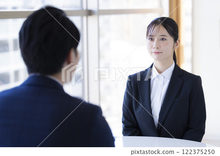 Job hunting: Woman undergoing an interview 122375250