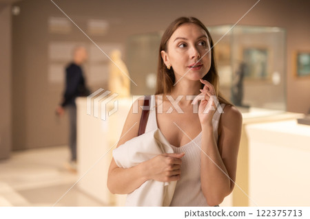 Thoughtful Woman in the Museum Hall 122375713